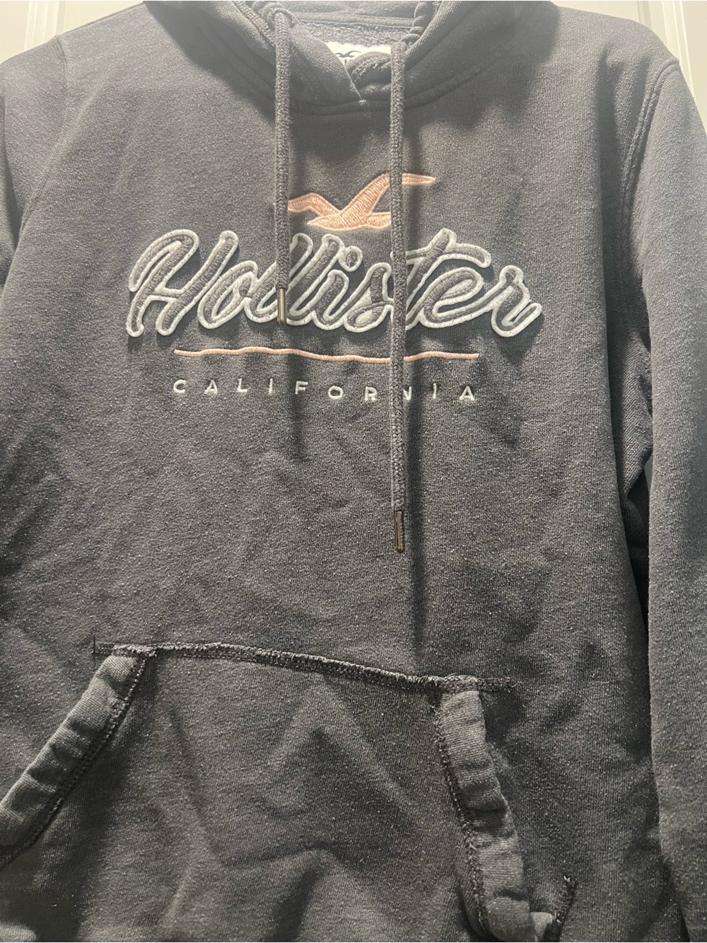 Hollister Black Hoodie Sweater with Embroidered Script and Accent